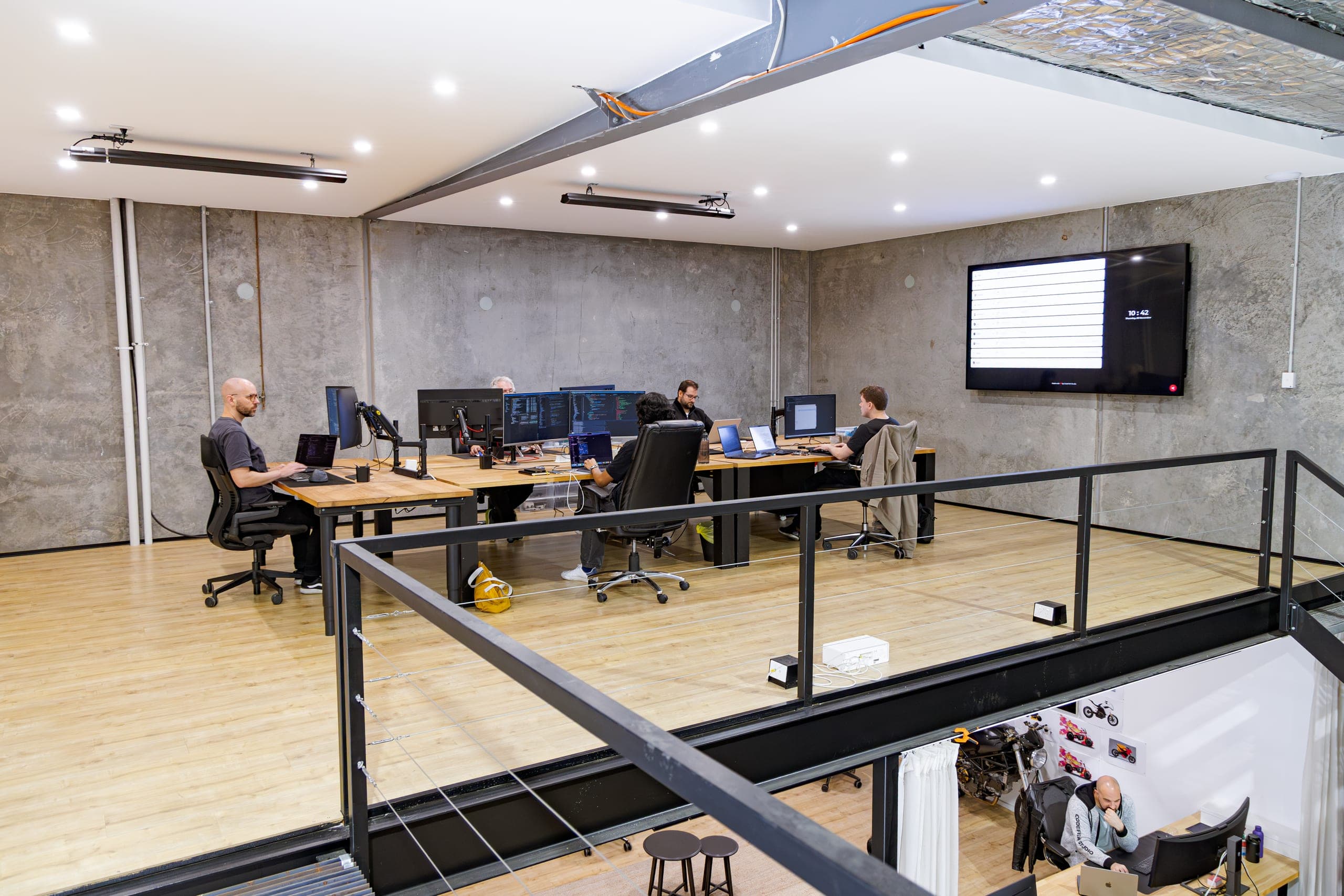The CodeFish Studio workspace in Adelaide, developers working at desks on the studio floor
