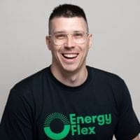 A smiling team member in an EnergyFlex branded T-shirt