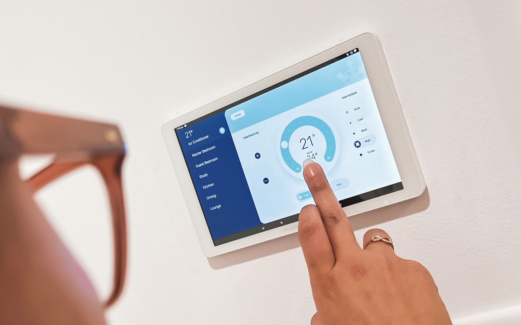 A user interacting with the Platinum Elite air conditioner controller